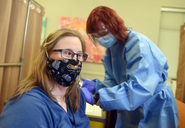 Brittany Franks and Karen Klee at the KW Habilitation Vaccination Clinic. (photo by The Record)