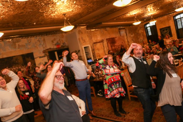 Staff dancing at our 2023 Staff Recognition event.