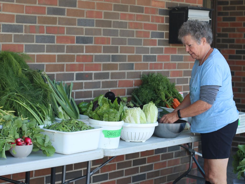 Jenny Our Farm Coordinator at KW Habilitation preparing vegetables for our fresh produce pick up.