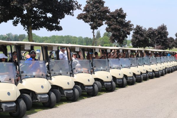 Participants all lined up in their golf carts at KW Habilitation's 2023 Annual Golf Tournament.
