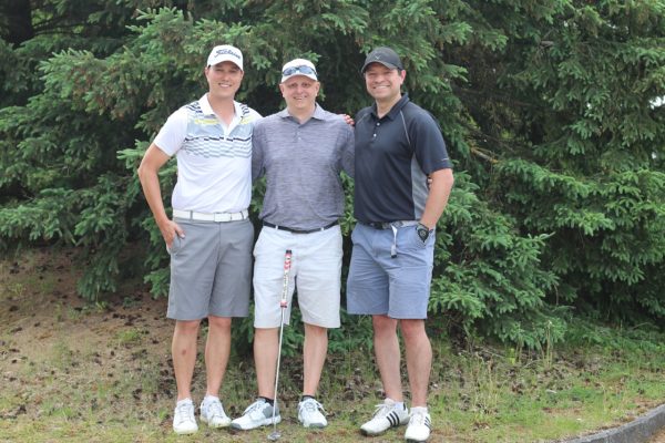 Three golf participants smiling at KW Habilitation's 2023 Annual Golf Tournament.