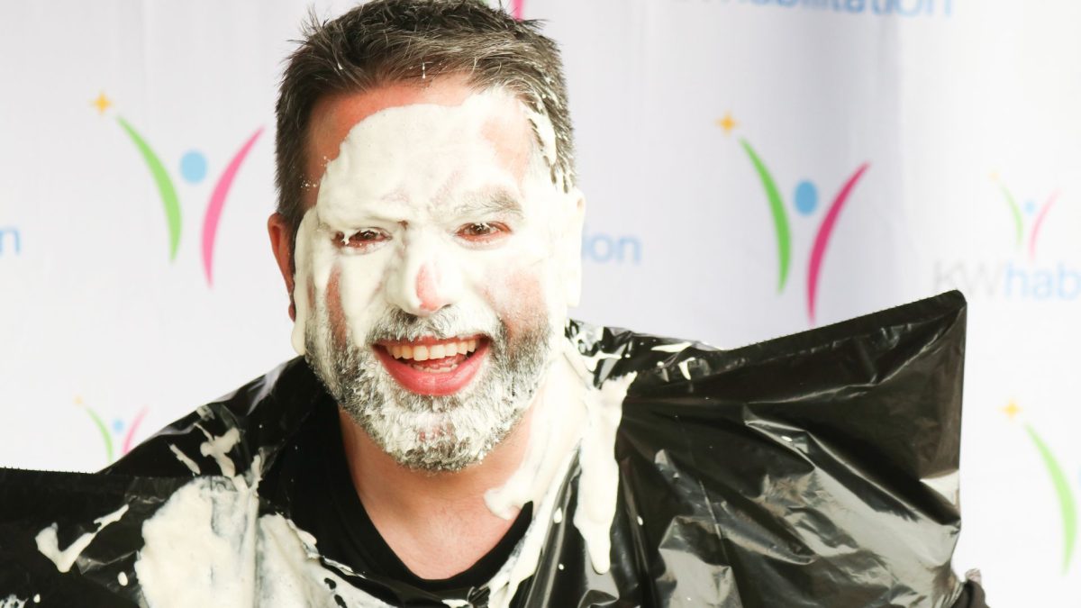 Jeremy our Director of IT smiling after getting a pie in the face from our Pie in the Face Day!