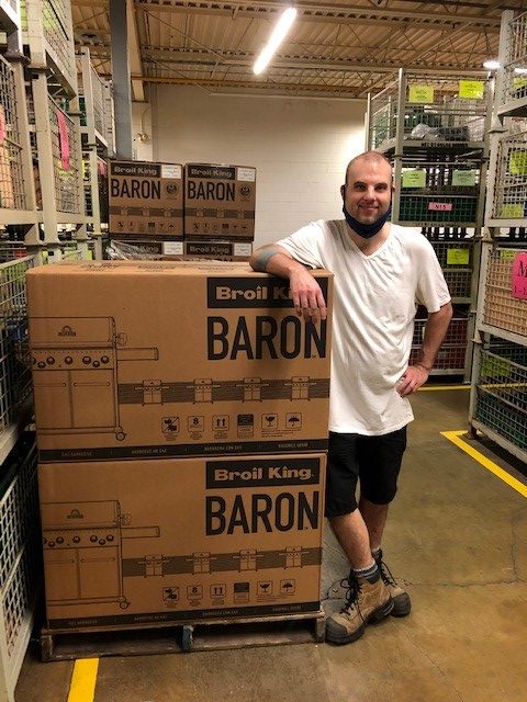 Graeme at Onward Manufacturing standing beside boxes of barbecues. Title says: Graeme’s Journey to Success with KW Career Compass. There is a KW Career Compass logo and a KW Habilitation logo